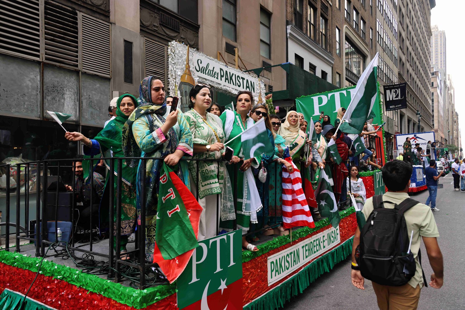 Pakistan Day Parade celebration showing community members in traditional attire